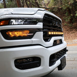 2025+ RAM 2500 light bar 40in PRO curved LED installed on white 2025 RAM 2500 front grille