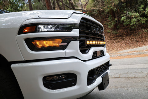 2025+ RAM 2500 light bar 40in PRO curved LED installed on white 2025 RAM 2500 front grille