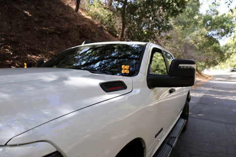 2025+ RAM 2500 & 3500 Ditch Lights PRO dual color amber DRL installed on white RAM truck hood