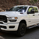 2025+ RAM 2500 & 3500 Ditch Lights installed on white RAM HD truck with dual color white LED and amber DRL backglow