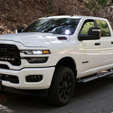 2025+ RAM 2500 & 3500 Ditch Lights installed on white RAM HD truck with dual color white LED and amber DRL backglow