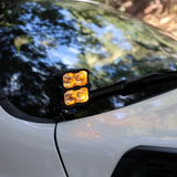 2025+ RAM 2500 & 3500 Ditch Lights PRO dual color amber DRL mounted at windshield cowl on white RAM truck