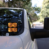 2025+ RAM 2500 & 3500 Ditch Lights dual color amber DRL pods mounted by driver side mirror on white truck