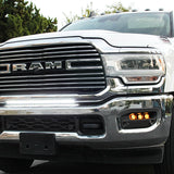 RAM 2500 Fog Light Kit installed on 2025 RAM 2500 truck with slotted fog light bezel and illuminated amber fog lights