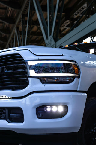 RAM 2500 Fog Light Kit 2025+ installed on white RAM 2500 truck showing bright LED fog lights on front bumper