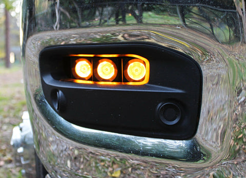 RAM 2500 Fog Light Kit installed with three amber LED fog lights on chrome front bumper