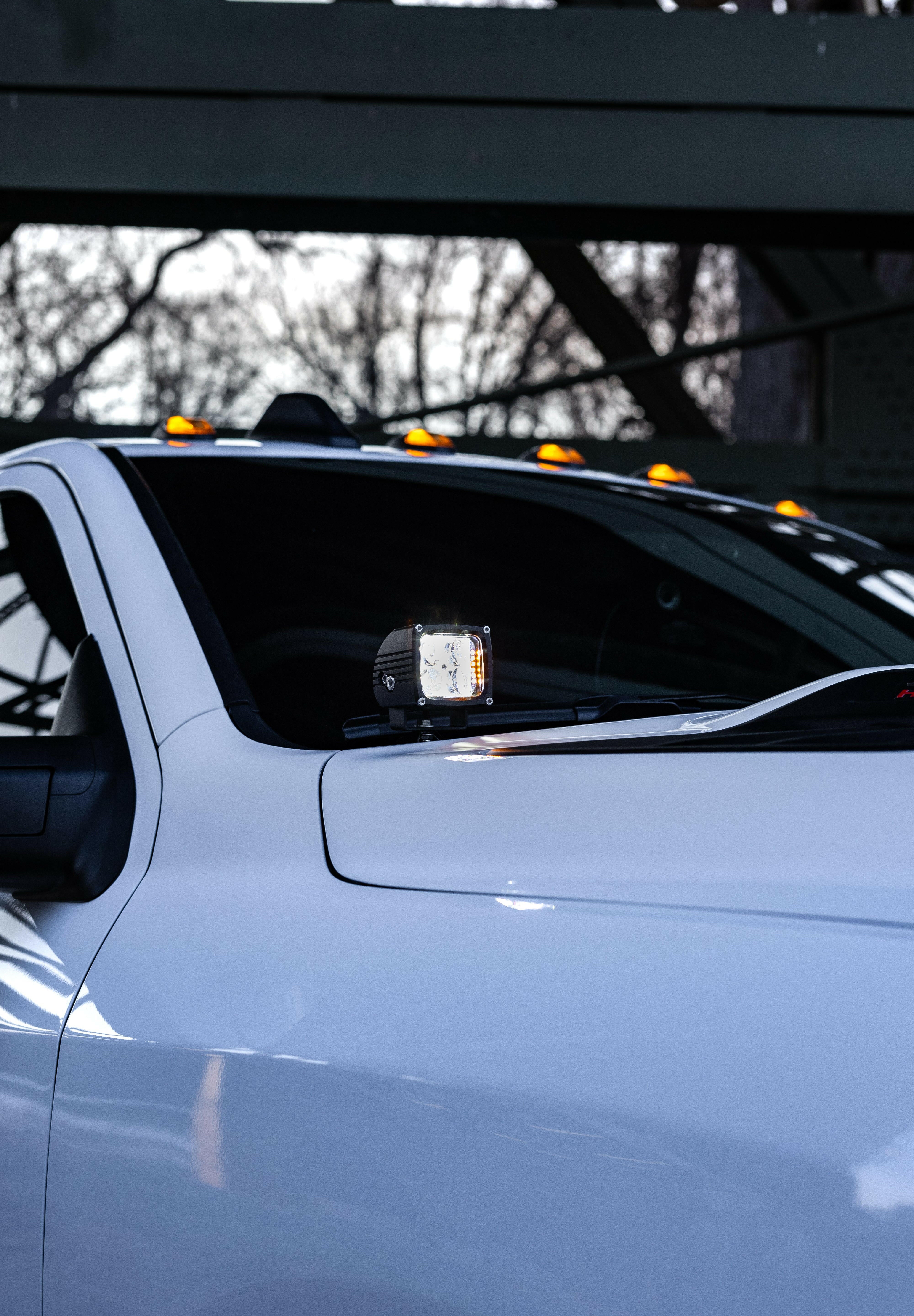 2025+ RAM 2500 3500 Ditch Lights dual color LED ditch light mounted on white RAM HD truck