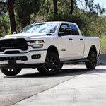 2025+ RAM 2500 Light kit lower grille LED pod lights installed on white RAM 2500 truck front view