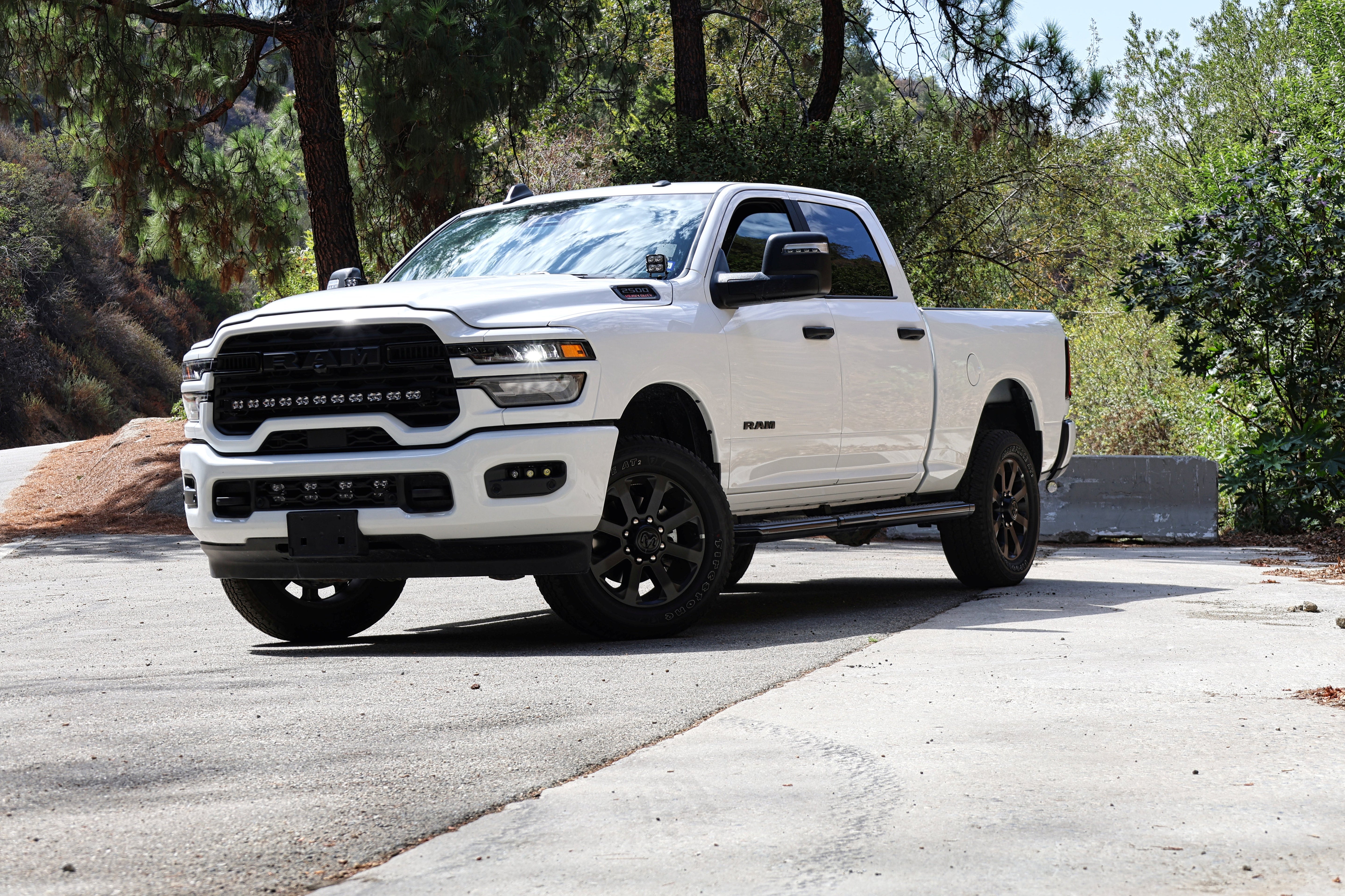 2025+ RAM 2500 Light kit lower grille LED pod lights installed on white RAM 2500 truck front view