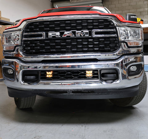 RAM 2500 lightbar Bumper Light kit installed in lower grille with dual LED light pods on 2019-2024 RAM 2500 front bumper