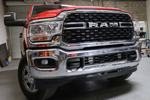 RAM 2500 lightbar Bumper Light kit installed in lower grille on 2019-2024 RAM 2500 front bumper with LED pods