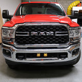 RAM 2500 lightbar Bumper Light kit installed in lower grille on red RAM 2500 truck front view