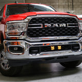 RAM 2500 lightbar Bumper Light kit installed on 2019-2024 RAM 2500 lower grille with LED light pods illuminated