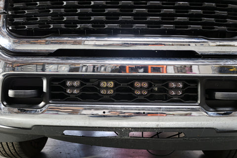 RAM 2500 lightbar Bumper Light kit installed in lower grille with 4 LED light pods on 2019-2024 RAM 2500 front bumper
