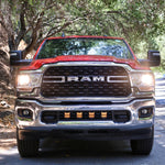 RAM 2500 lightbar Bumper Light kit installed with lower grille LED light pods on 2019-2024 RAM 2500 truck front view