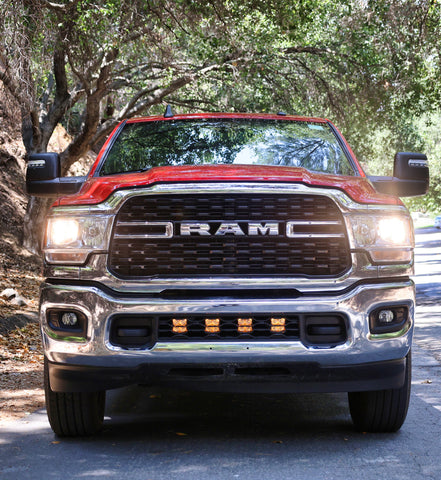 RAM 2500 lightbar Bumper Light kit installed with lower grille LED light pods on 2019-2024 RAM 2500 truck front view