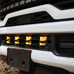 2025+ RAM 2500 Light kit lower grille pods with amber LED lights installed, no-cut bolt-on truck lighting upgrade