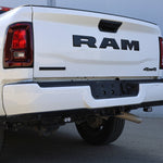 RAM 2500 Reverse Light Kit installed under rear bumper on white RAM 2500 truck, showcasing bright LED reverse pods