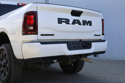 RAM 2500 Reverse Light Kit installed under rear bumper on white RAM 2500 truck, showcasing bright LED reverse pods