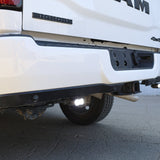 RAM 2500 Reverse Light Kit installed under rear bumper, bright white LED pods illuminating behind 2025 RAM 2500 truck