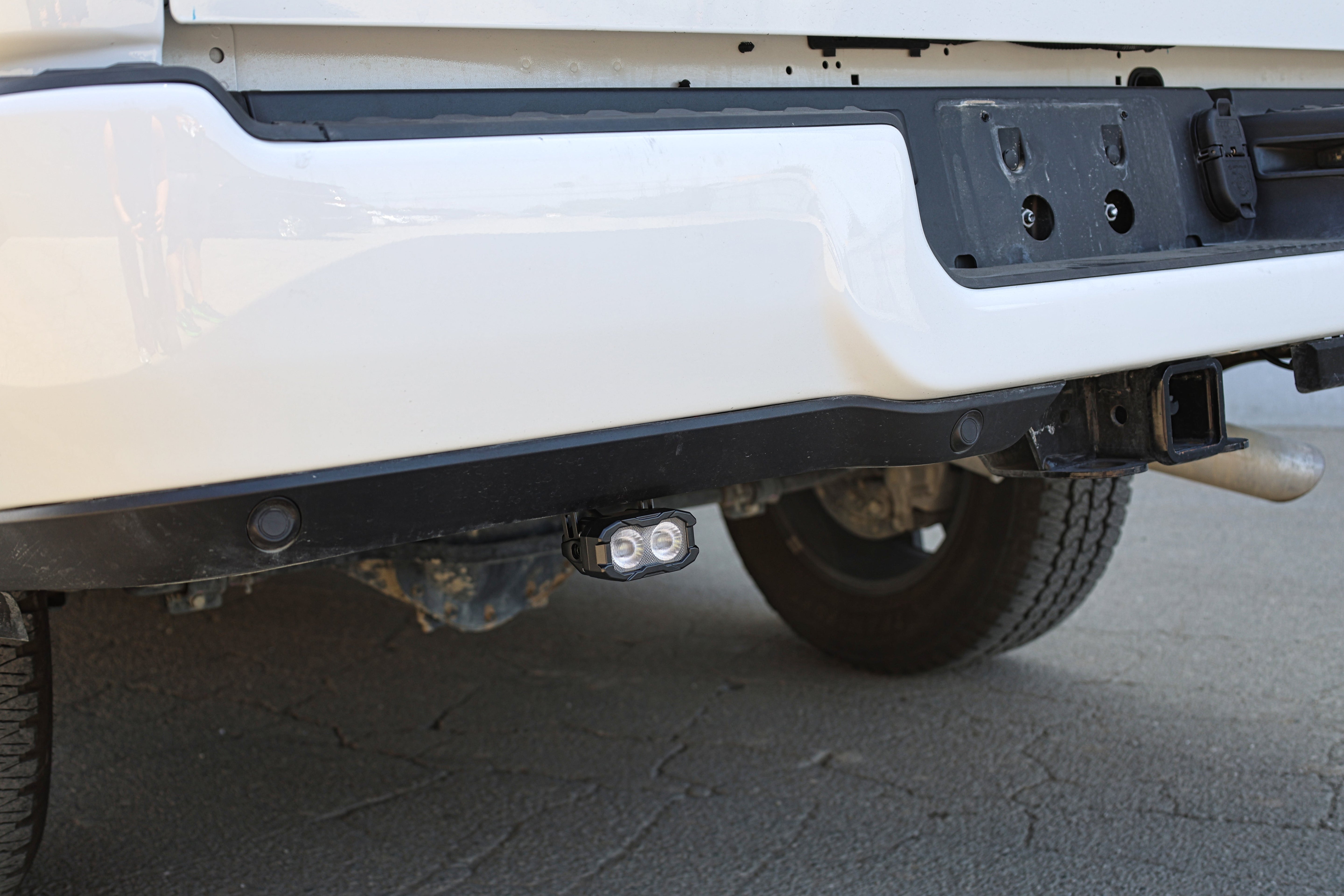 RAM 2500 Reverse Light Kit installed under rear bumper showing pair pod LED reverse light on 2025+ RAM 2500 truck