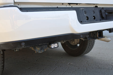 RAM 2500 Reverse Light Kit installed under rear bumper showing pair pod LED reverse light on 2025+ RAM 2500 truck