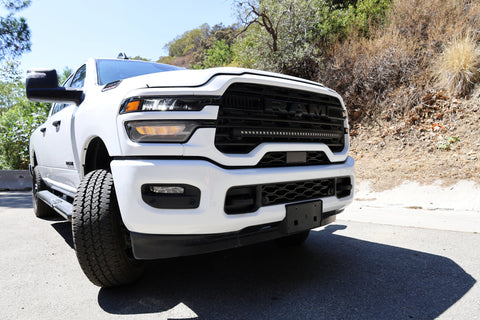 2025+ RAM 2500 light bar slim 40in curved LED installed on white RAM 2500 truck front bumper view