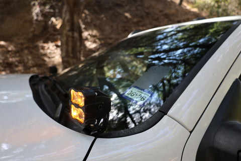 RAM 2500 Ditch Lights dual color amber DRL mounted on 2019-24 RAM 2500 windshield pillar for off-road visibility