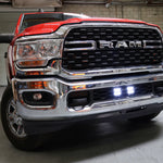 RAM 2500 lightbar Bumper Light kit installed with lower grille LED light pods on 2019-2024 RAM 2500 front chrome bumper