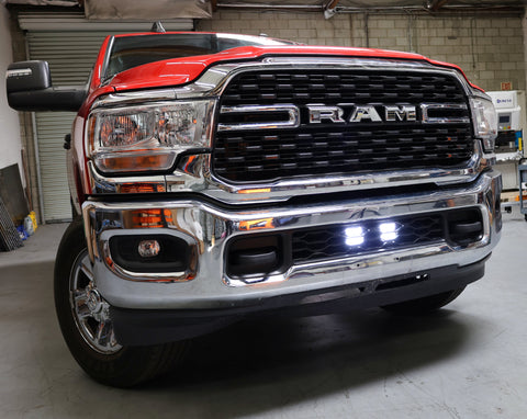 RAM 2500 lightbar Bumper Light kit installed with lower grille LED light pods on 2019-2024 RAM 2500 front chrome bumper