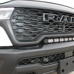 RAM RHO light bar PRO 23in curved LED mounted between grille and bumper on 2025 RAM 1500 RHO Rebel front view