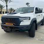 RAM RHO light bar PRO installed on white RAM 1500 RHO between grille and bumper, slim curved LED front lighting upgrade