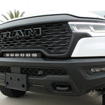 RAM RHO light bar PRO 23in curved LED installed between grille and bumper on 2025 RAM 1500 RHO front view