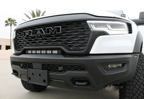 RAM RHO light bar PRO 23in curved LED installed between grille and bumper on 2025 RAM 1500 RHO front view