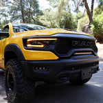 RAM TRX Light bar slim 23in installed in factory grille opening on yellow 2021-2024 RAM 1500 TRX front view