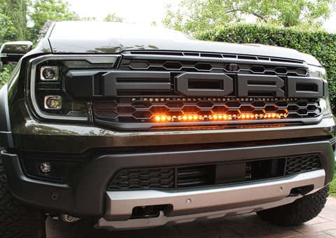 2024 ranger raptor dual LED light bars in amber behind the grille