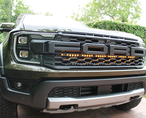 2024 ranger raptor dual LED light bars in amber behind the grille