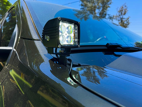 2024 Ford Ranger Raptor hood mount ditch light showcasing bright LED and amber backglow for enhanced aesthetics.