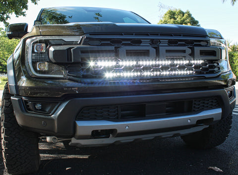 2024 ranger raptor dual LED light bars in white behind the grille