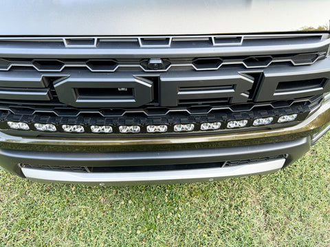 curved LED light bar in front grille of 2024 ford ranger raptor