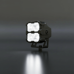 Black LED work light on a dark background