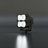 Black LED work light on a dark background