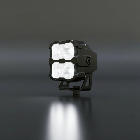 Black LED work light on a dark background