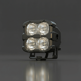 Black off-road light on a dark gray background