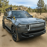 gray 2023 rivian with ditch lights for off roading 