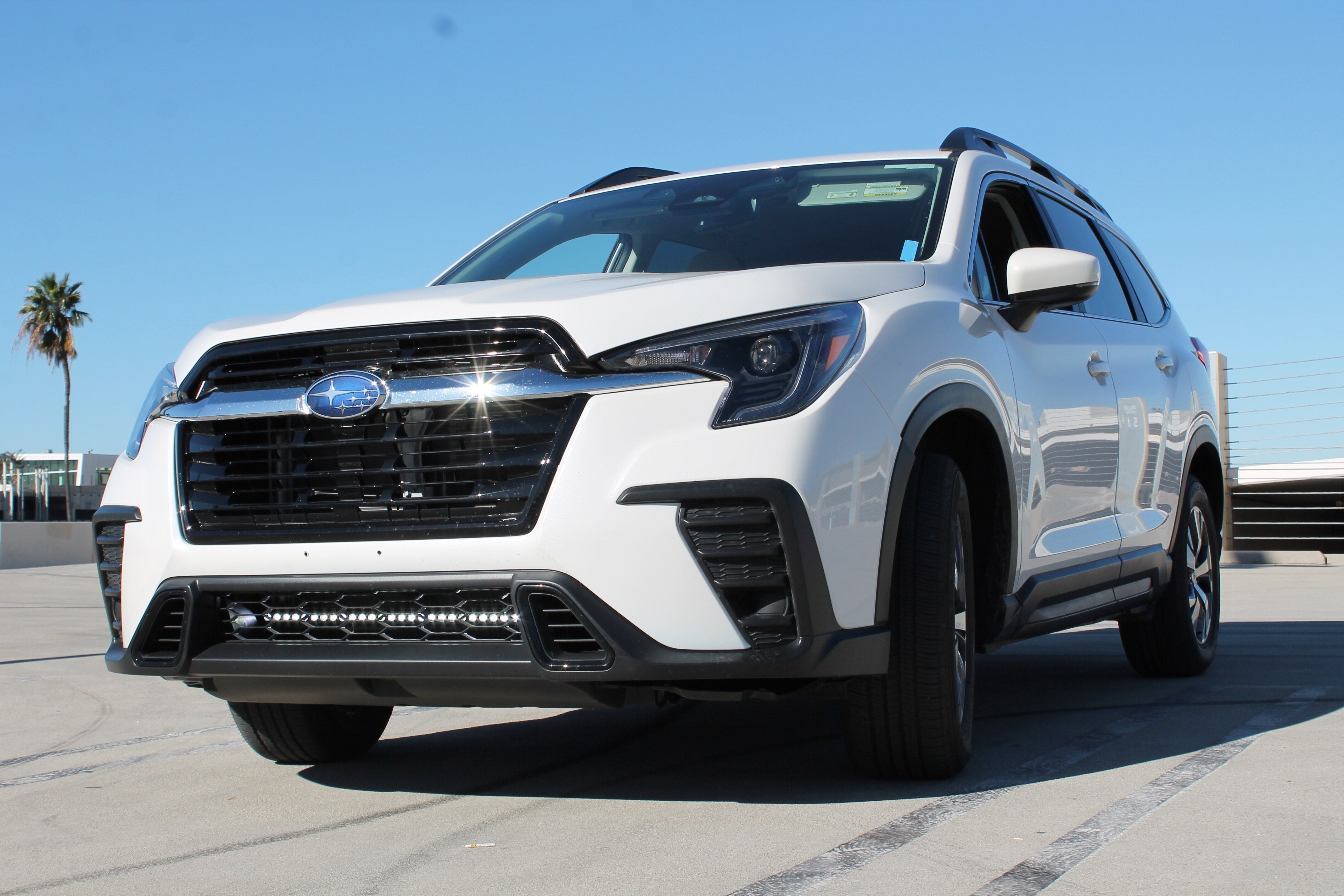 Subaru Ascent SLIM light bar, front view on a white SUV, no-drill bolt-on kit for 2019-2026 Ascent