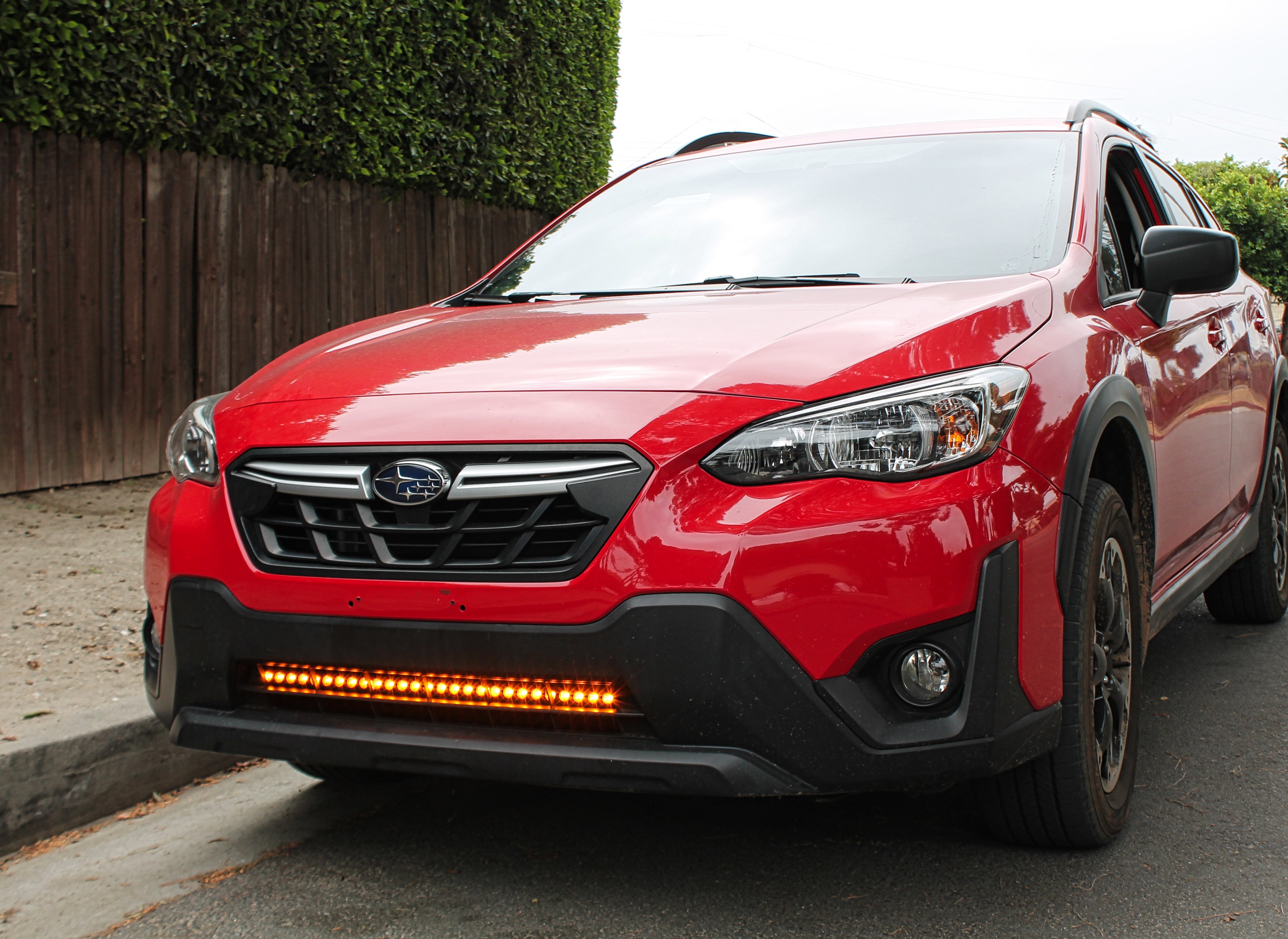 red 2022 subaru crosstrek gen 2 with light bar in lower grille for off roading