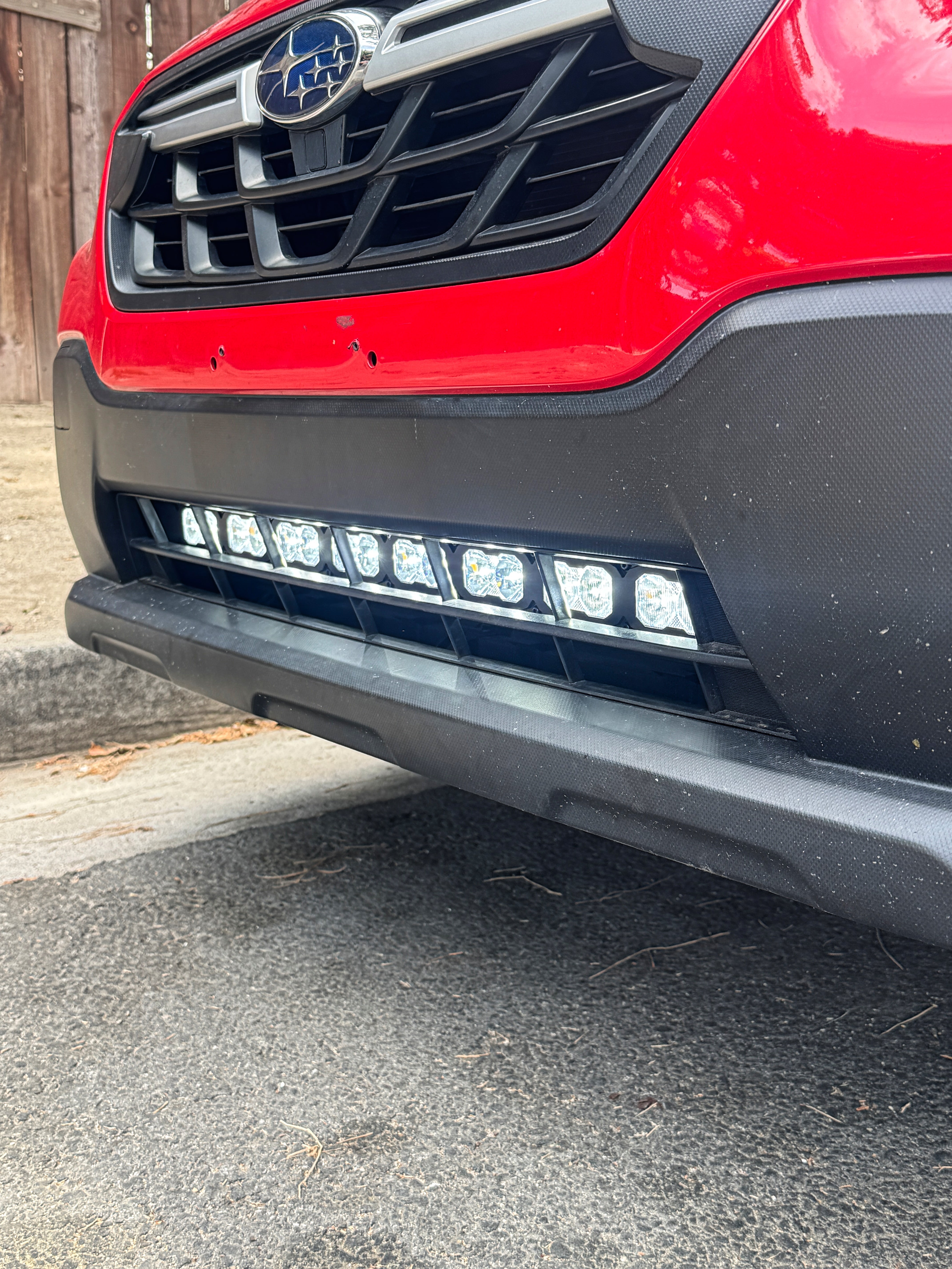 red 2022 subaru crosstrek gen 2 light bar off roading in lower grille