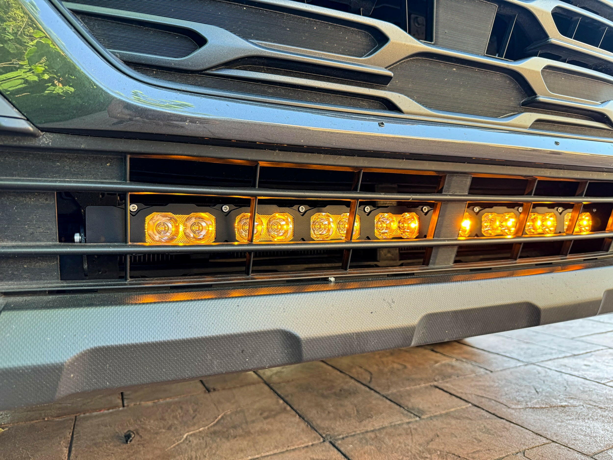 grey subaru outback with amber daytime running lights led light bar off roading