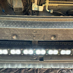 grey subaru outback with white led light bar off roading